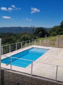 a swimming pool on top of a house at Departamento Tierralta in Malagueño