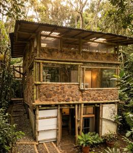a house in the middle of a forest at Bosque Hondo Ecoliving in Medellín