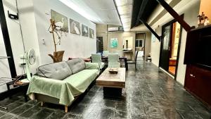 a living room with a couch and a table at Montra Resort in Lamai +88 photos