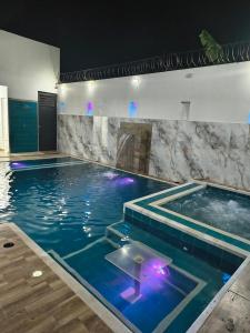 a large swimming pool with aitating at RICAURTE CASA PISCINA PRIVADA in Ricaurte