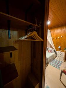 a small room with a bed and a closet at Herdade da Hera in Azambuja
