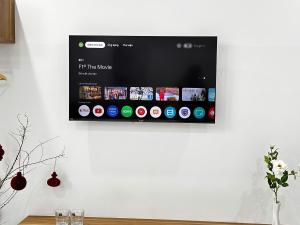 a tv hanging on a wall on a wall at Mai Phương Motel in Pleiku +15 photos