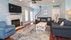 a living room with blue walls and a fireplace at 1036 Maryland Ave in Cape May