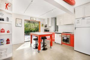 a kitchen with a table and two stools at A AAA Coke Shack in Point Lookout