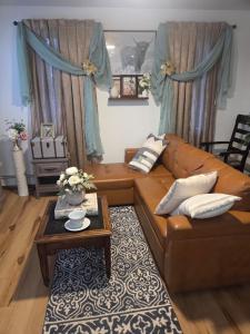 a living room with a couch and a coffee table at Brooklyn Luxury Suite in Brooklyn