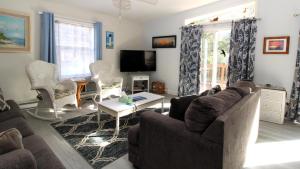 a living room with a couch and a table at 149 Emerald Avenue in West Cape May