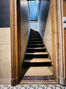 a stairway leading up to a building with a staircase at Chambre à soulac in Soulac-sur-Mer +1 photo