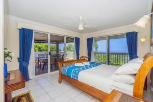 a bedroom with a bed and a balcony at Cloud 9 Eagle Heights - Cliff-Top, Ocean Sunrise, VIP Retreat in Mount Tamborine