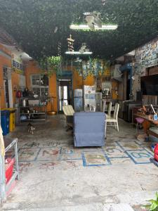 a living room with a couch and chairs in it at 背包客棧Backpackers Hostel in Checheng