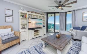 a living room with a television and a couch at Phoenix III 3126 in Orange Beach