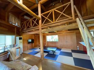 a large room with a blue and white checkered floor at レインボーマリン in Mihama