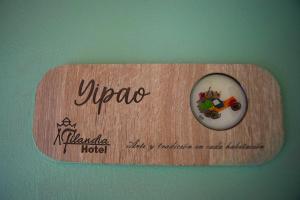 a sign on a wall that says yuccca hotel at FILANDIA HOTEL in Filandia