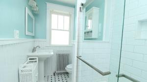 a bathroom with a toilet and a sink at Windsor Escape in Cape May +29 photos