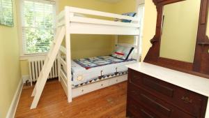 a bunk bed in a room with a bunk bedscribed at Windsor Escape in Cape May