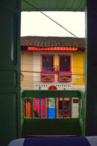 a building with colorful doors and windows in front at FILANDIA HOTEL in Filandia +92 photos