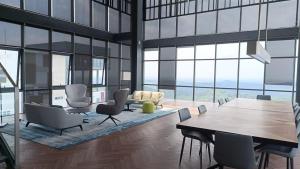 a living room with a table and chairs at Adilili Mesahill Premier Homestay, Nilai near KLIA USIM AEON Mall Mesa Mall Aurelius Hospital in Nilai
