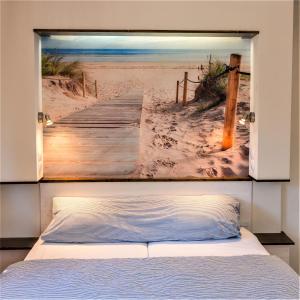 Ein Bett oder Betten in einem Zimmer der Unterkunft Strandfeeling