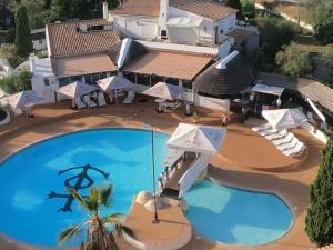 an aerial view of a resort with a large swimming pool at Chalet avec terrasse - 7 pers. - API-1-52-2181 in Lattes