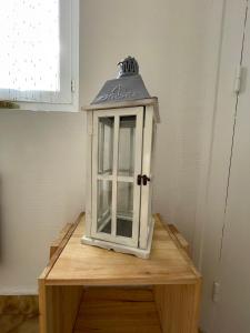 a lantern sitting on top of a wooden table at Maison a Confluence T2BZ-Tram in La Mulatière