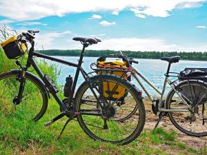 two bikes parked next to a body of water at 4 person holiday home in Tibro in Tibro