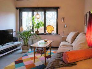 a living room with a couch and a table at 4 person holiday home in Tibro in Tibro