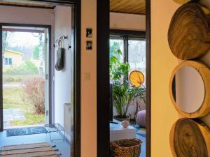 a room with a mirror on the wall and a door at 4 person holiday home in Tibro in Tibro