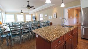 a kitchen and dining room with a table and chairs at 209 Congress Street in Cape May