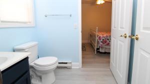 a bathroom with a toilet and a sink at 149 Emerald Avenue in West Cape May +19 photos