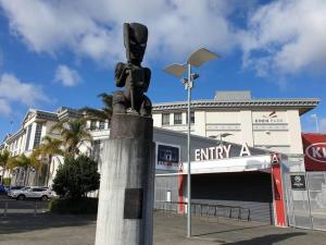 a statue of a traffic light in front of a store at At Eden Park Motel in Auckland