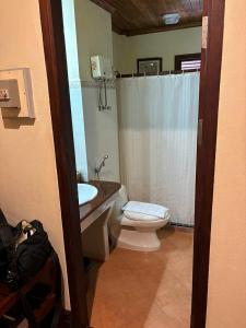 a bathroom with a toilet and a sink at Villa Saykham in Luang Prabang +74 photos