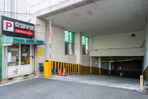 an entrance to a building with a parking garage at 루엠호텔안산 in Ansan