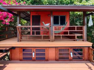 a small house with a porch and a deck at Tao Thong Villa 2 in Ko Tao
