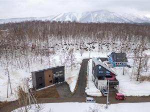 an aerial view of a building in the snow at Soga House in Niseko
