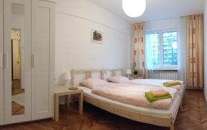 Posteľ alebo postele v izbe v ubytovaní Center Warsaw - Apartament Jana Pawła