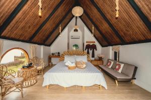 a bedroom with a bed with two baskets on it at นวนิยาย Nava-Niyay in Ban Huai Ti