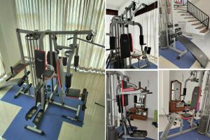 a gym with a treadmill and a treadmill at The white house in Kelaniya