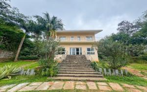 a house with stairs leading up to it at The Temple Tree Residence in Yelagiri