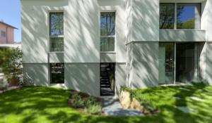 a white building with windows on the side of it at Le stanze di Caterina in Cesenatico +30 photos