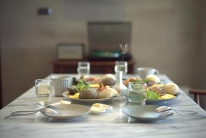 a table with plates of food on top of it at Tomoya in Chenggong +32 photos