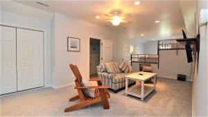 a living room with a couch and a table at Fairwinds Cottage in Cape May