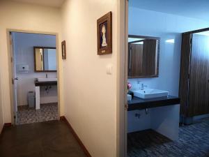 a bathroom with a sink and a mirror at Baan Nan B&B Hotel in Nan +58 photos