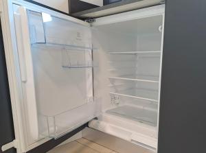 an empty white refrigerator with its door open at GUEST ROOM GRADONOVE in Arco