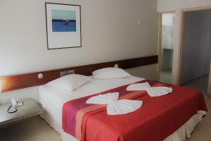 Uma cama ou camas num quarto em Hotel Delta
