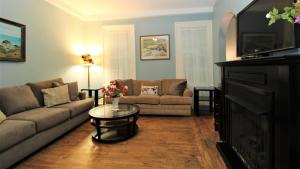 a living room with a couch and a table at Cottage At 37 Jackson in Cape May