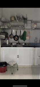 a kitchen with a sink and a counter top at Vùng ven Homestay in Cho Lach