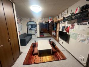 a conference room with a table and a couch at 旭川ロキ in Asahikawa