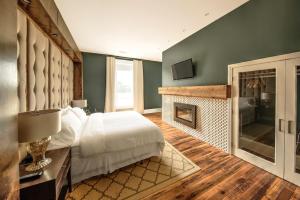 Ένα ή περισσότερα κρεβάτια σε δωμάτιο στο The Harkness Hotel