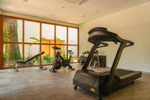 a gym with several exercise bikes in a room at Hotel Boutique Las Hortensias in Pilar