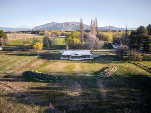 an aerial view of a house in the middle of a field at Omahau Down in Lake Pukaki +54 photos