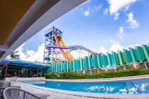 a view of a water park with a roller coaster at Waterworld Hotel Cebu in Mandaue City